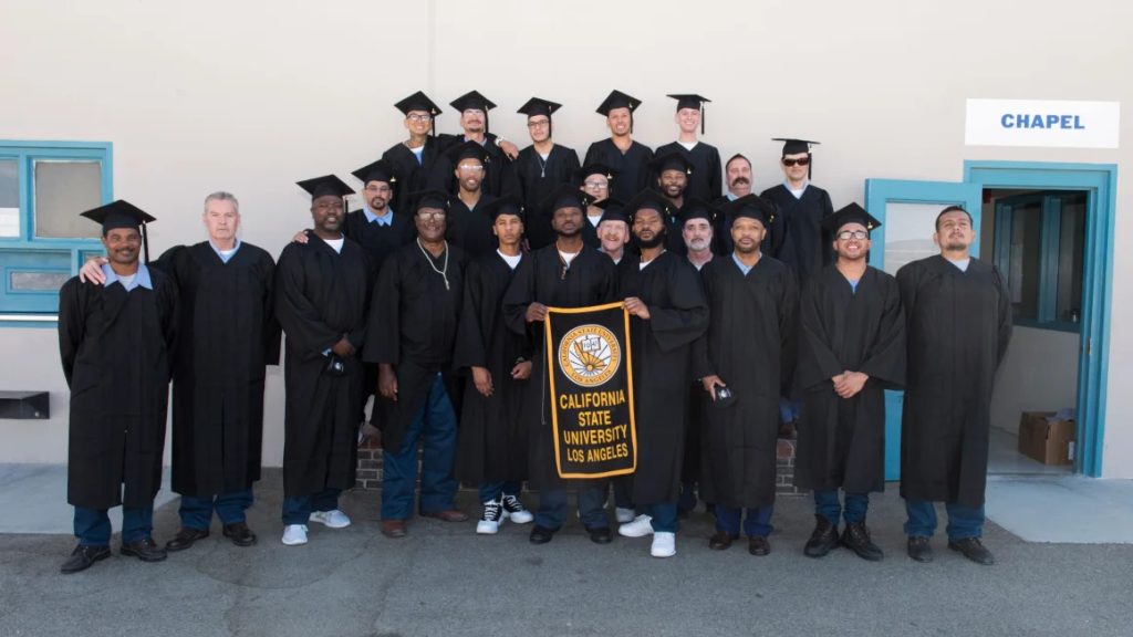 Graduates who earned their Bachelor's Degrees while incarcerated at their graduation ceremony in 2021.